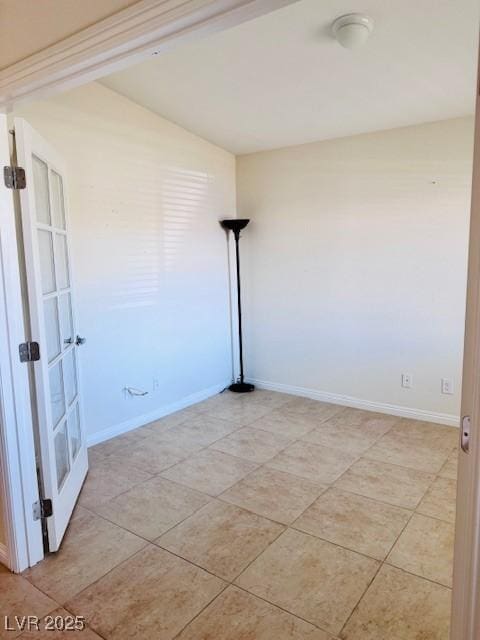 4562 White Cap Mill St, Las Vegas, NV 89147 - spare room featuring baseboards, light tile patterned floors, and french doors