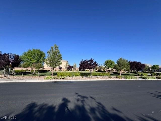 4562 White Cap Mill St, Las Vegas, NV 89147 - view of asphalt road with traffic signs and sidewalks