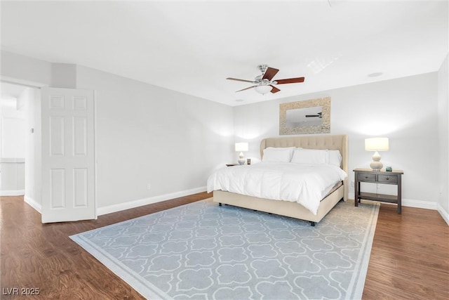 bedroom featuring wood finished floors, a ceiling fan, and baseboards