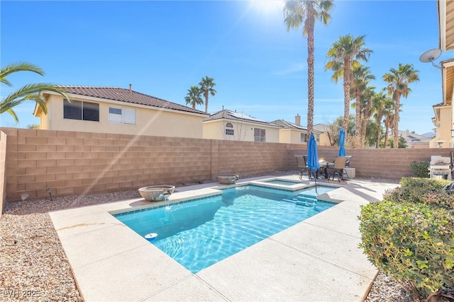 view of pool featuring a patio area, a fenced backyard, a fenced in pool, and an in ground hot tub