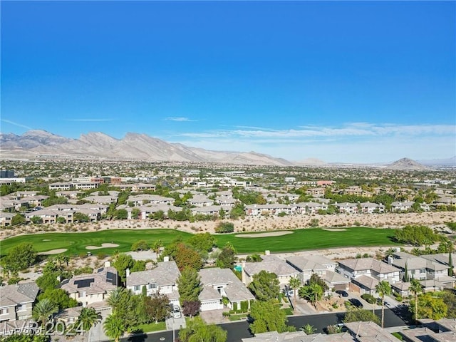 birds eye view of property featuring view of golf course and a mountain view