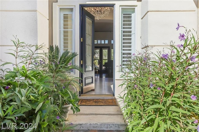 property entrance featuring stucco siding