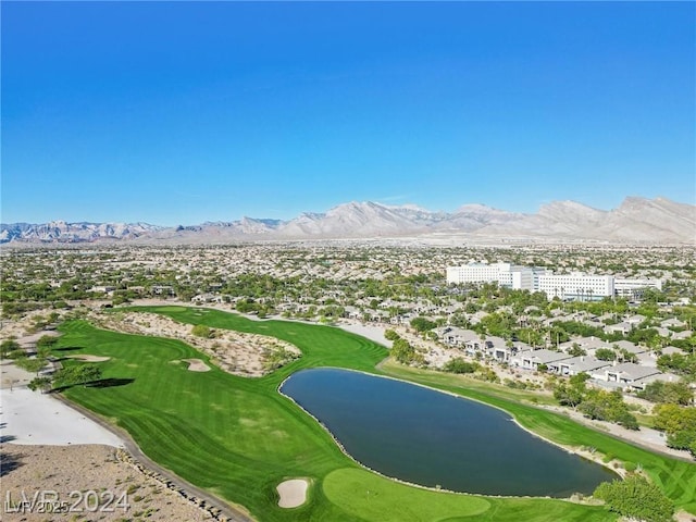birds eye view of property featuring golf course view and a water and mountain view