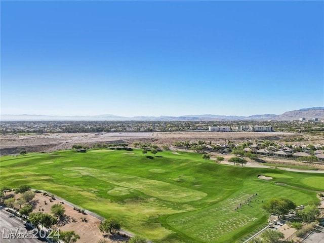 birds eye view of property featuring golf course view and a mountain view
