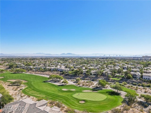 drone / aerial view featuring view of golf course and a mountain view