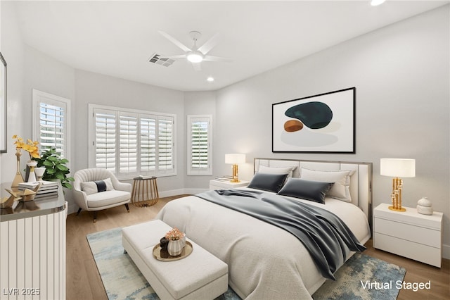 bedroom with baseboards, visible vents, a ceiling fan, wood finished floors, and recessed lighting