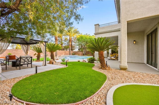 view of yard featuring a patio, a fenced backyard, and a fenced in pool