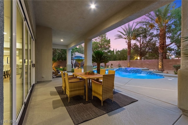 view of pool featuring a patio area, a fenced backyard, a fenced in pool, and outdoor dining space