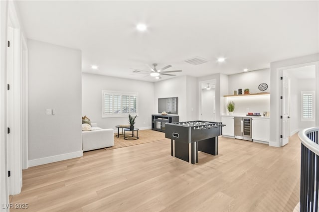 game room featuring visible vents, plenty of natural light, and light wood finished floors