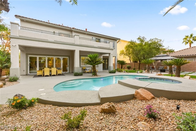 back of property featuring a gazebo, a patio, fence, and stucco siding