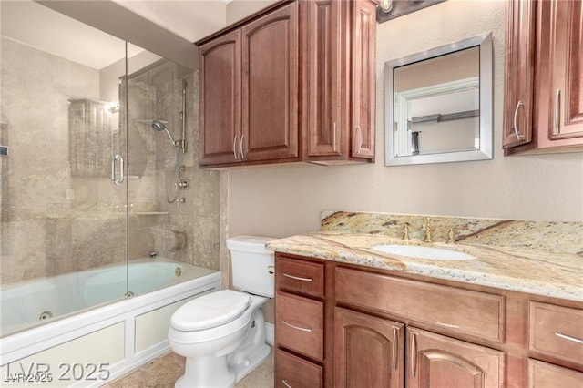 full bath featuring combined bath / shower with glass door, vanity, and toilet