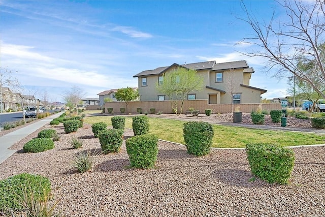 surrounding community with a lawn and a residential view