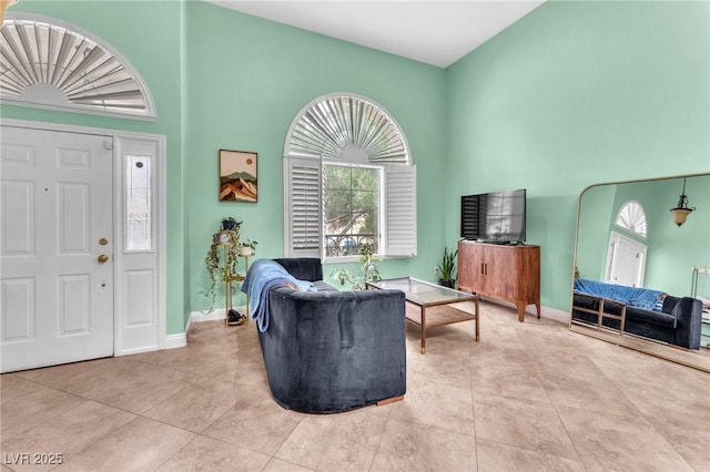 living room with tile patterned floors and baseboards