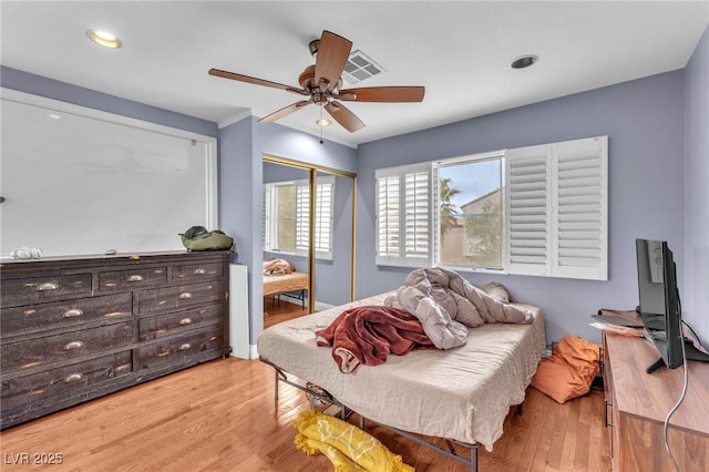 bedroom featuring visible vents, recessed lighting, wood finished floors, a closet, and a ceiling fan