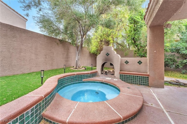 view of pool with an in ground hot tub, an outdoor fireplace, and a fenced backyard