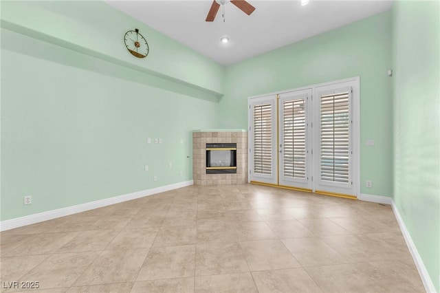 8629 Estrelita Dr, Las Vegas, NV 89128 - unfurnished living room featuring a ceiling fan, a tile fireplace, baseboards, tile patterned flooring, and recessed lighting