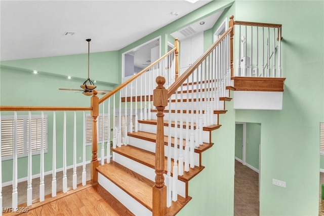 8629 Estrelita Dr, Las Vegas, NV 89128 - stairway with a ceiling fan, wood finished floors, high vaulted ceiling, and baseboards