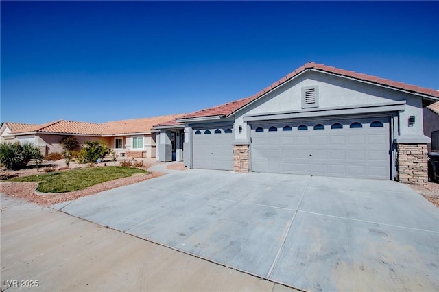 ranch-style house featuring an attached garage, a tile roof, stone siding, concrete driveway, and stucco siding