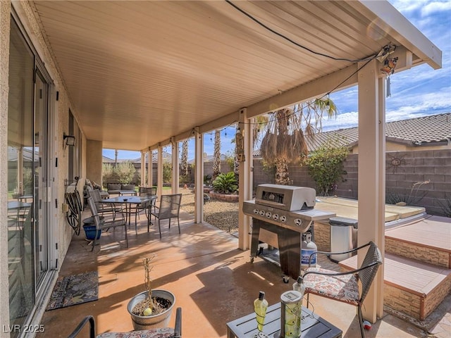 view of patio / terrace featuring a fenced backyard, outdoor dining area, and area for grilling