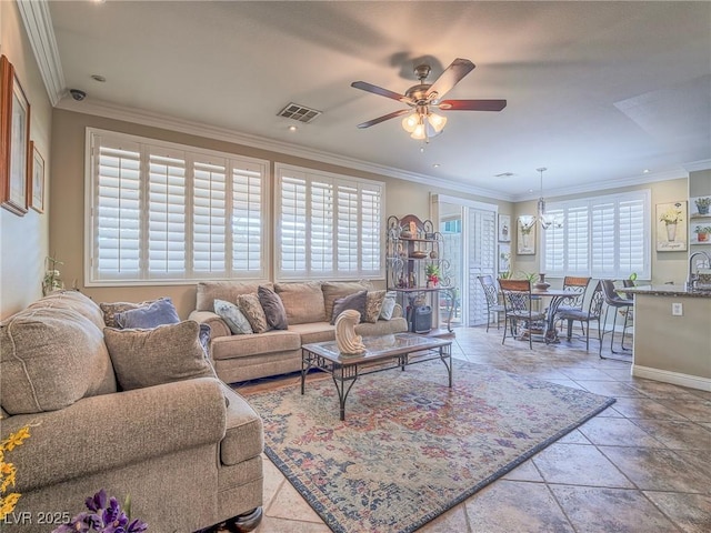 living area featuring light tile patterned floors, crown molding, visible vents, and ceiling fan with notable chandelier