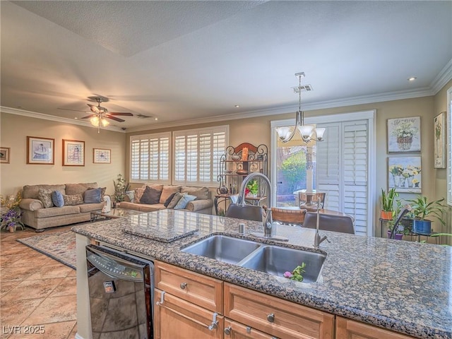 kitchen with black dishwasher, pendant lighting, open floor plan, and a sink