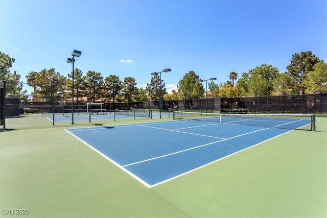 view of sport court with fence