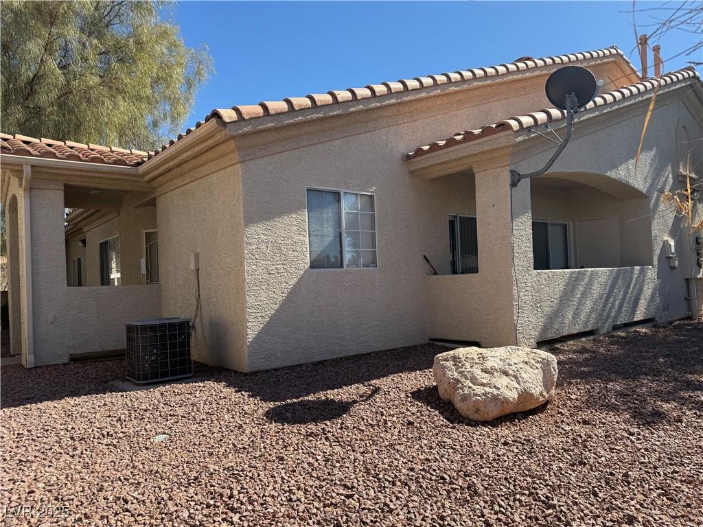 view of property exterior featuring central AC and stucco siding