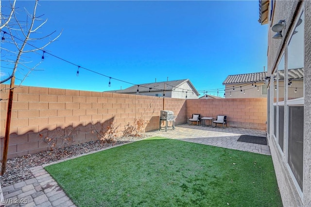 view of yard featuring a fenced backyard and a patio