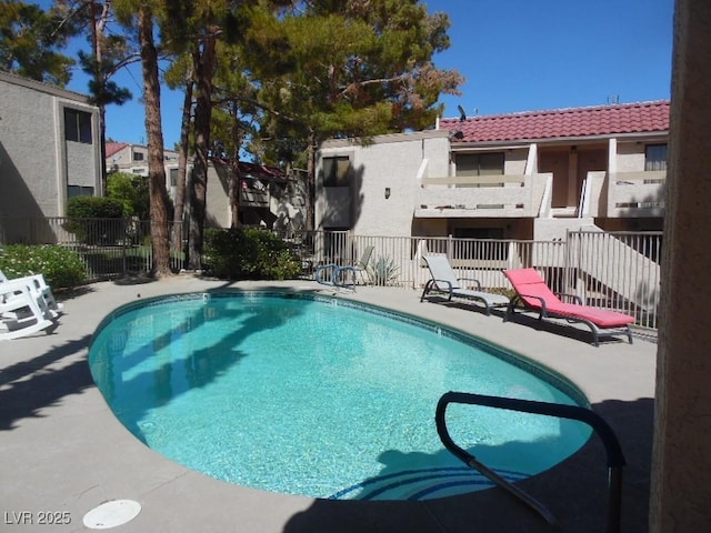 community pool featuring fence