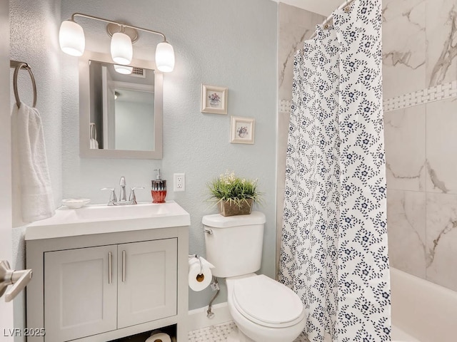 bathroom featuring shower / bath combo, vanity, and toilet