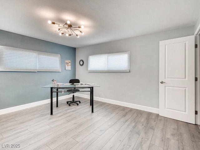 office space with light wood finished floors and baseboards