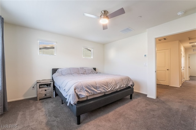 bedroom with a ceiling fan, dark colored carpet, visible vents, and baseboards