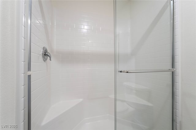 bathroom featuring a stall shower