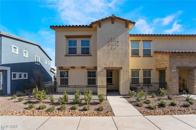 view of front of house featuring a fenced front yard and stucco siding