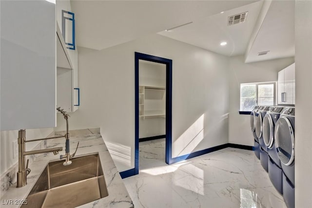 laundry room featuring laundry area, baseboards, visible vents, marble finish floor, and separate washer and dryer