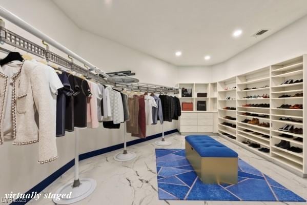 spacious closet featuring marble finish floor and visible vents