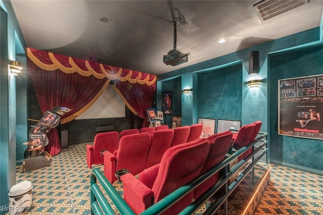 home theater room with carpet floors, baseboards, and visible vents