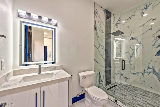 full bathroom with toilet, a marble finish shower, and vanity