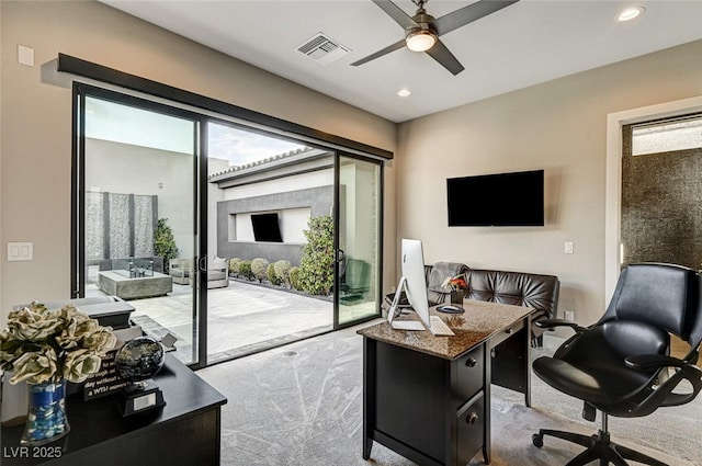 office featuring carpet floors, ceiling fan, visible vents, and recessed lighting