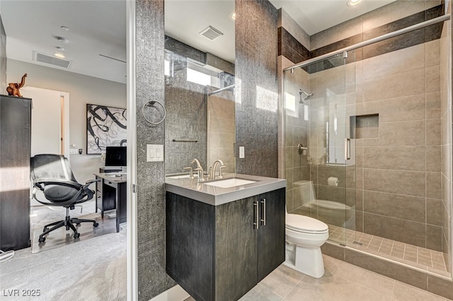 bathroom with visible vents, a shower stall, and toilet