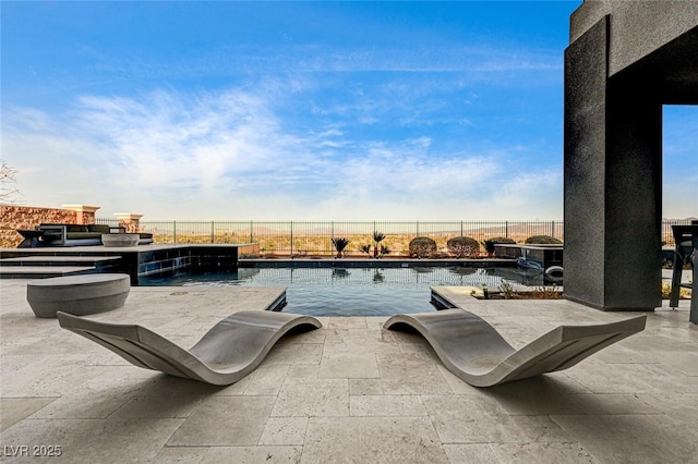 view of swimming pool featuring a patio area, a fenced backyard, and a fenced in pool