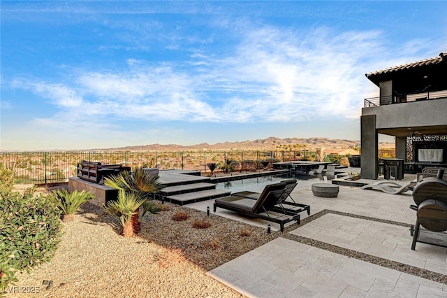 view of swimming pool featuring a fenced in pool, a fenced backyard, and a patio