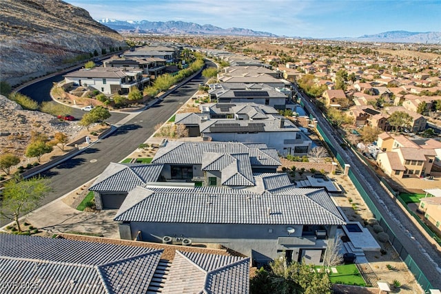 drone / aerial view featuring a residential view and a mountain view