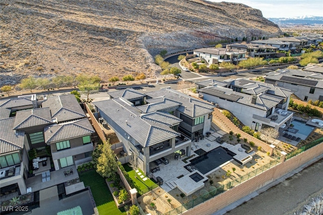 drone / aerial view featuring a mountain view and a residential view