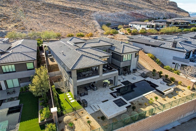 drone / aerial view with a residential view and a mountain view