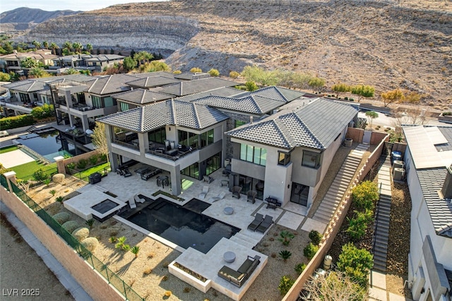 birds eye view of property with a residential view and a mountain view