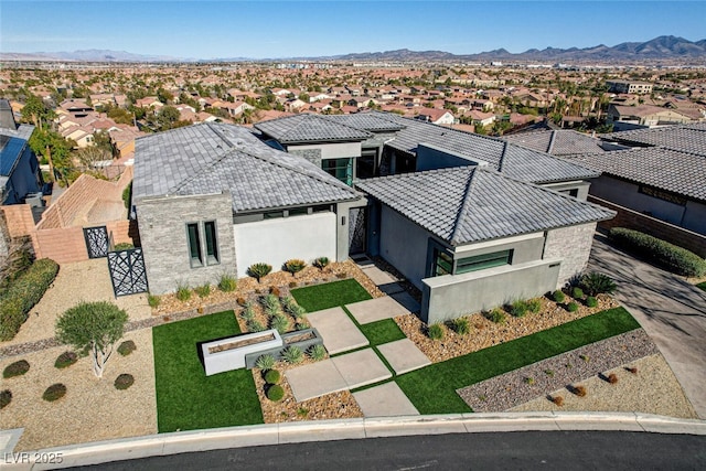 birds eye view of property with a residential view and a mountain view