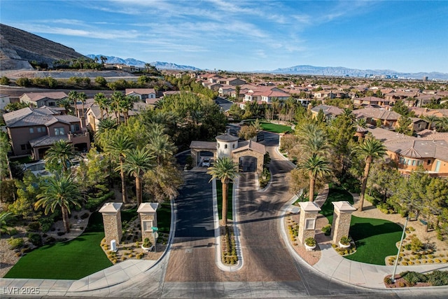 drone / aerial view featuring a residential view and a mountain view