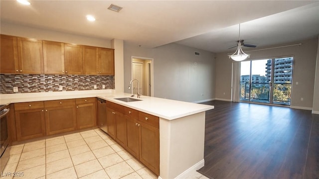 8255 Las Vegas Blvd Unit 415, Las Vegas, NV 89123 - kitchen with a peninsula, dishwasher, backsplash, light countertops, and recessed lighting