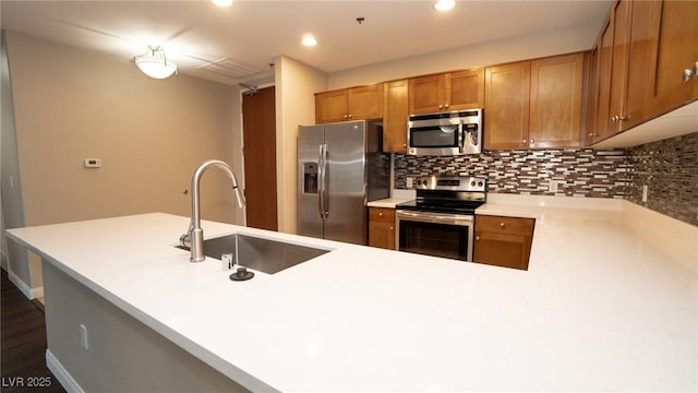 8255 Las Vegas Blvd Unit 415, Las Vegas, NV 89123 - kitchen featuring appliances with stainless steel finishes, backsplash, light countertops, recessed lighting, and brown cabinets